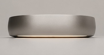 uGOvu Core seen from the side, its ambient light ring glowing softly against a desk
