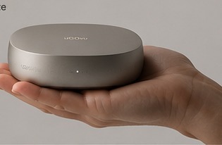 uGOvu Core held in an open hand, showing its compact pebble size